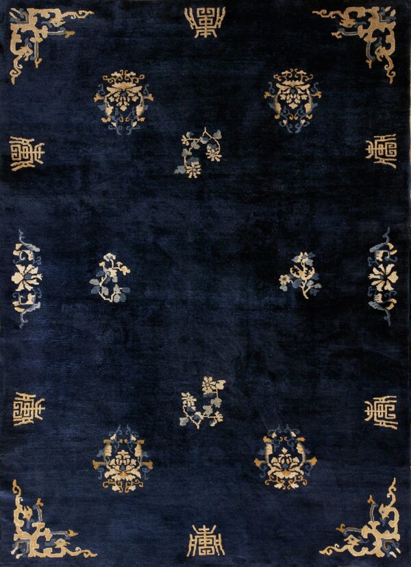 Deep blue high-pile rug with scattered golden and pale blue traditional floral and script designs.