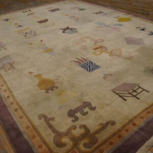 Cream rug with colorful scattered iconography and a wide dark purple border on rustic wood planks.