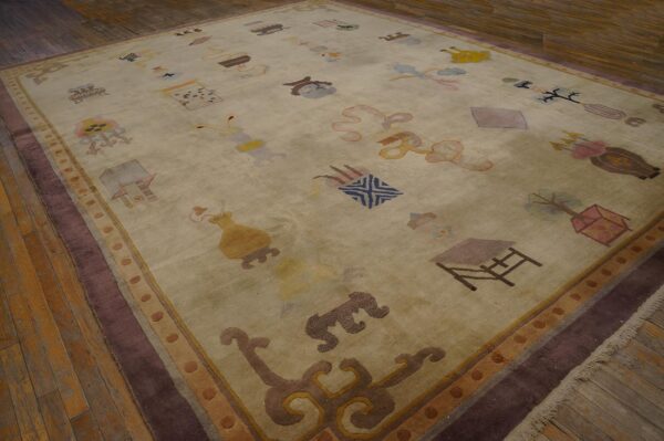 Cream rug with colorful scattered iconography and a wide dark purple border on rustic wood planks.