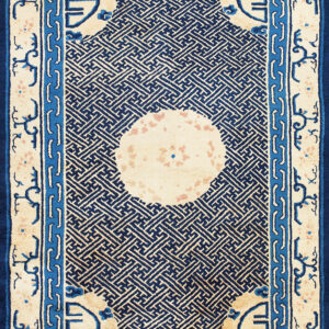 Cream rug with a dense dark blue geometric lattice pattern and multiple blue framed borders.