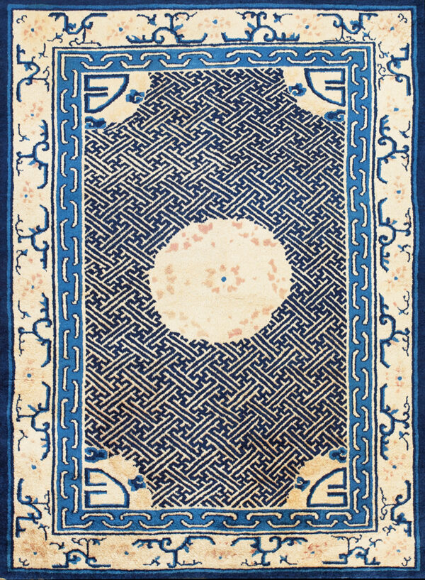 Cream rug with a dense dark blue geometric lattice pattern and multiple blue framed borders.