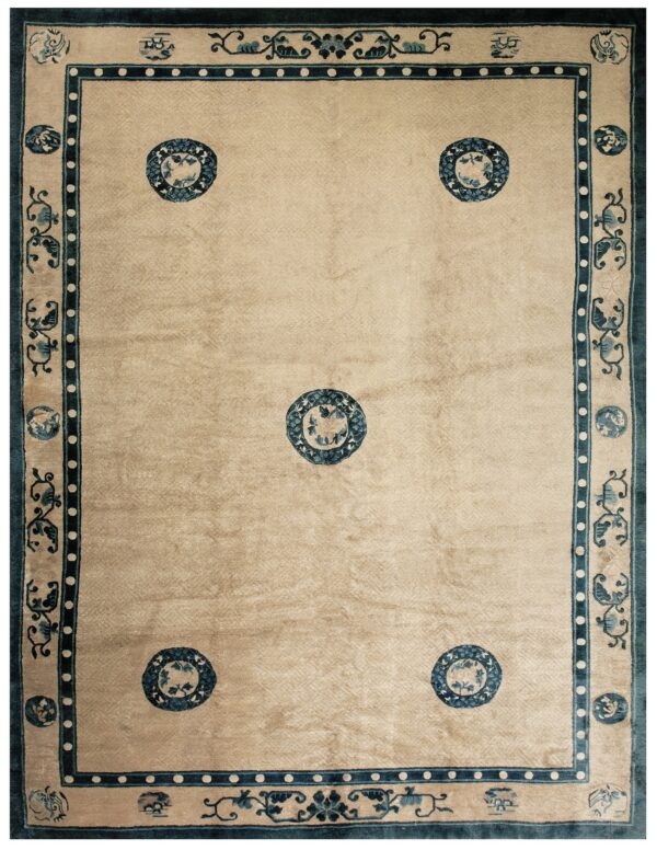 Beige high-pile rug with five blue medallions, framed by ornate blue and cream multiple-stripe borders.