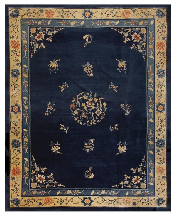 Dark blue rug featuring a light beige floral border and scattered coordinating motifs in the central field.