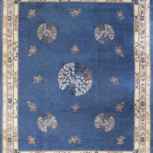 Blue rug with a wide cream and tan border, featuring five large circular floral medallions.