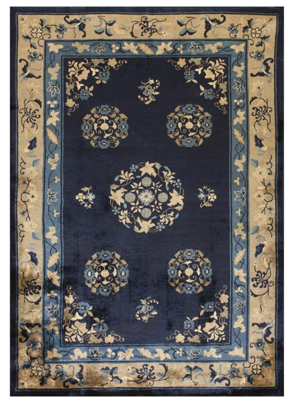 A plush navy rug featuring tan and light blue stylized floral medallions and wide decorative borders.