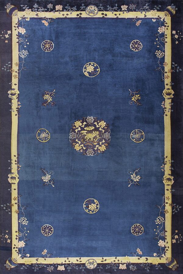 Deep blue rug with a large central animal medallion and light yellow borders featuring trailing florals.