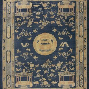 Dark blue rug with a dense pattern of tan gazebos, flowers, and butterflies, framed by detailed borders.