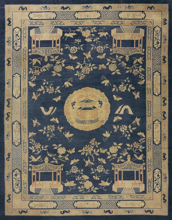 Dark blue rug with a dense pattern of tan gazebos, flowers, and butterflies, framed by detailed borders.