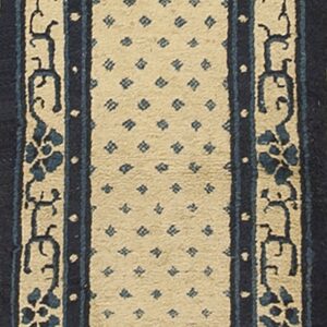 Navy and cream runner with a central dotted field and detailed stylized floral borders.
