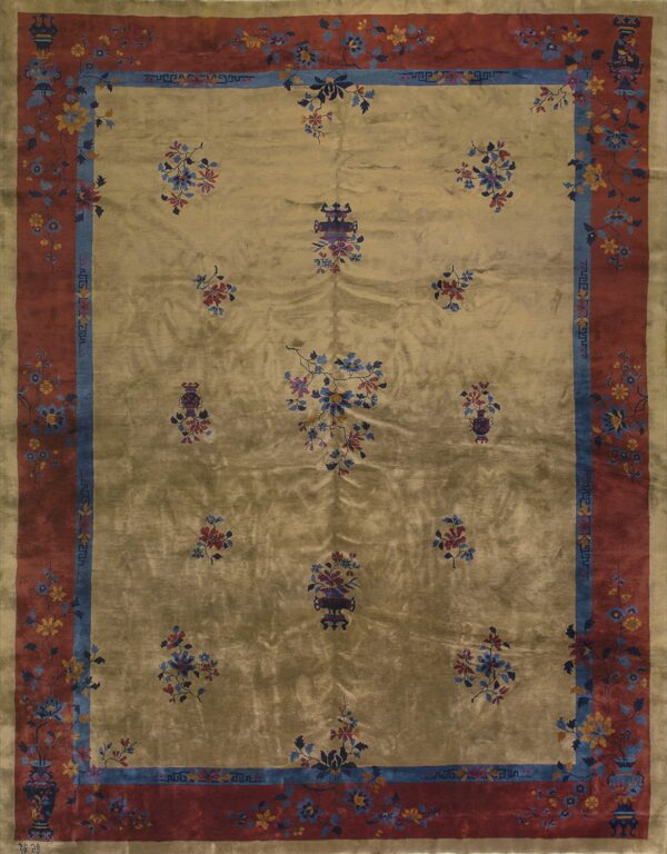 Shimmering gold rug with scattered floral bouquets, outlined by a rust-red and blue decorative border.