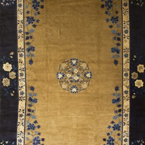Golden brown rug with a navy border and detailed floral medallions in shades of blue and cream.