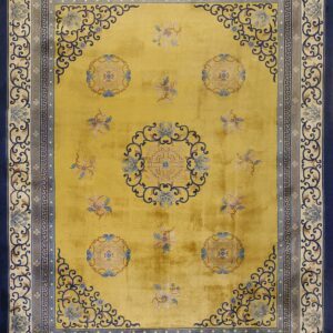 Bright yellow rug with navy blue, light blue, and beige borders featuring scrollwork and central medallions.