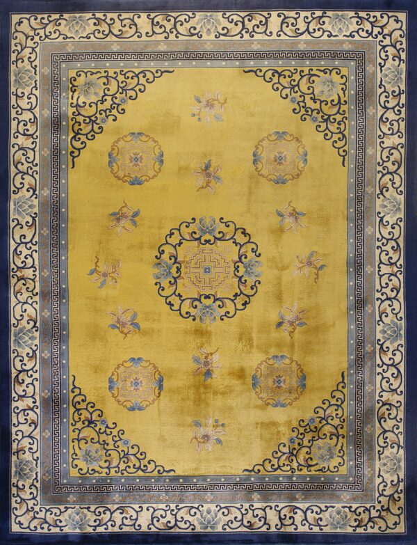 Bright yellow rug with navy blue, light blue, and beige borders featuring scrollwork and central medallions.