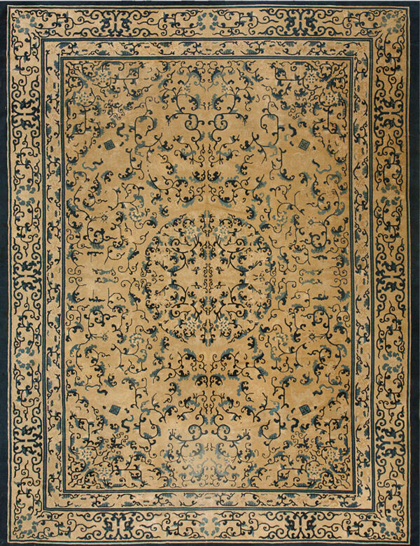 Gold rug with complex dark blue scrollwork and a central medallion, framed by wide navy borders.