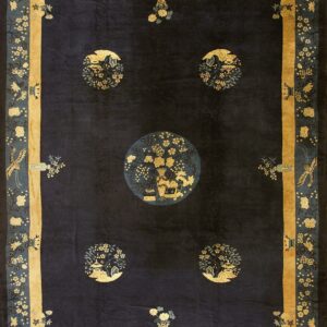 Navy blue traditional rug featuring five gold and teal medallions and an elaborate gold and blue floral border.