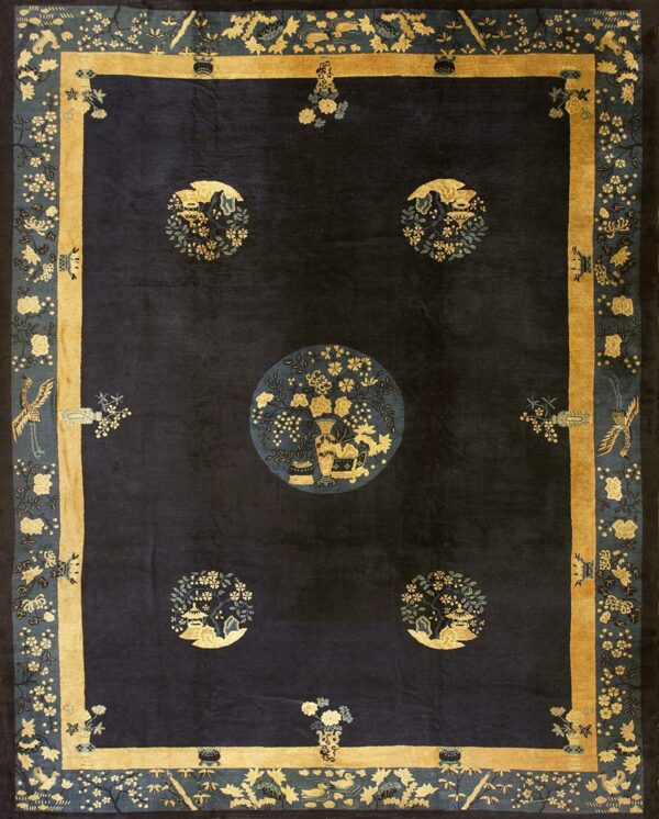 Navy blue traditional rug featuring five gold and teal medallions and an elaborate gold and blue floral border.
