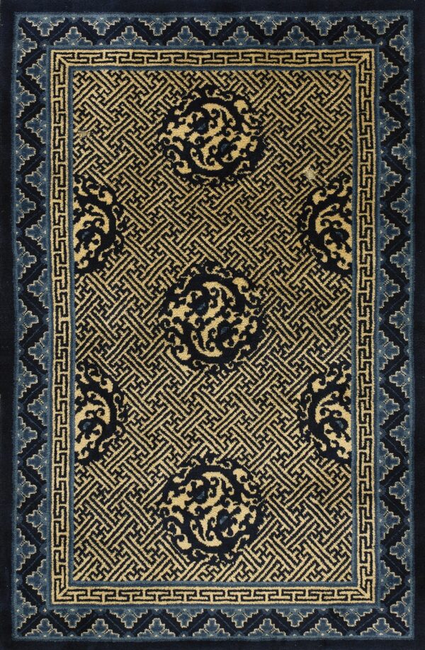 Gold and navy rug featuring detailed geometric fretwork, scrolling medallions, and a light blue stepped border.