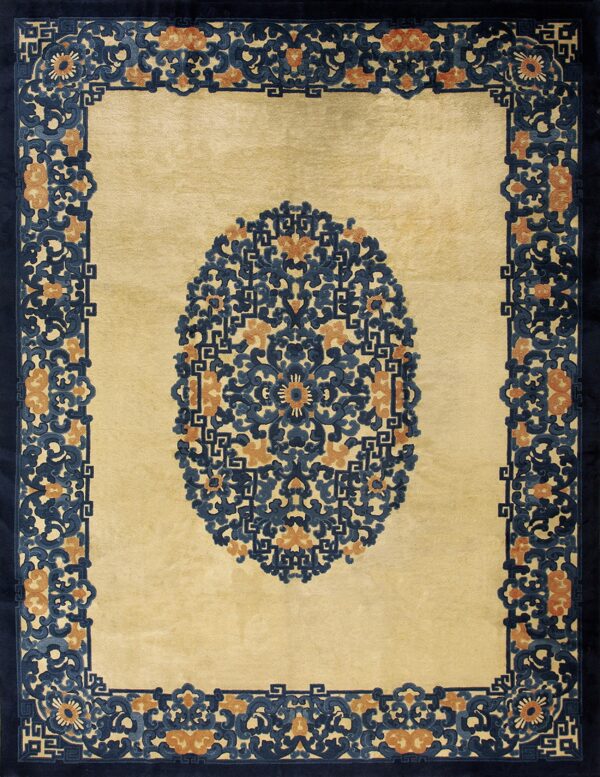 Yellow rug featuring a central oval of intricate blue and orange floral scrollwork and a wide navy border.