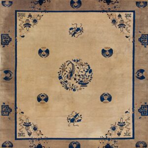 Beige rug with a taupe border and a blue phoenix medallion in the center field.