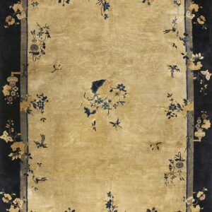 Gold field rug bordered by dark navy, featuring scattered stylized blue and tan floral and insect motifs.