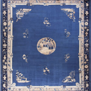 Deep blue rug featuring a central house scene, scattered florals, and wide decorative pictorial borders.