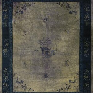 Greenish-gold rug featuring a dark indigo floral border and scattered central pictorial elements.