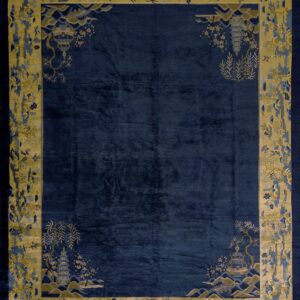 Navy rug with high sheen and an elaborate gold and blue border pattern of pagodas and trees.