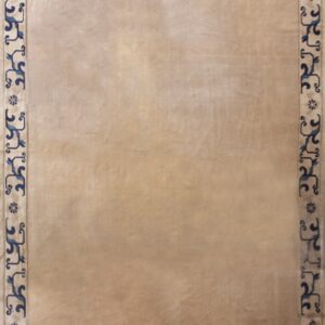 Beige rug with subtle sheen and a full border of stylized blue scrollwork and medallions.