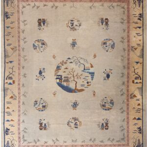 Pale rug featuring a detailed landscape medallion design and scattered vase motifs within wide scenic borders.