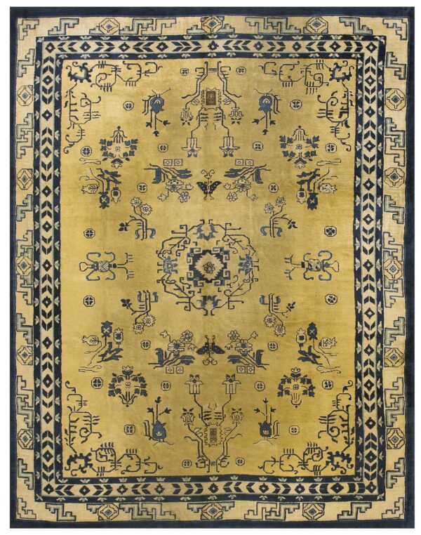 A gold field rug features elaborate dark blue geometric and stylized figurative patterns and borders.