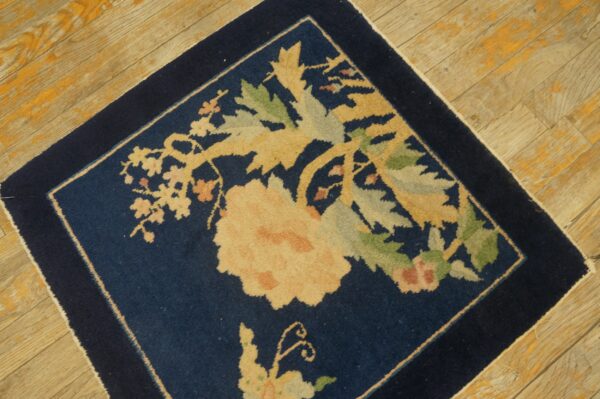 Antique peking square small scatter size wool black & navy rug 4 Navy blue floral square rug with gold and sage accents on worn wooden floorboards.