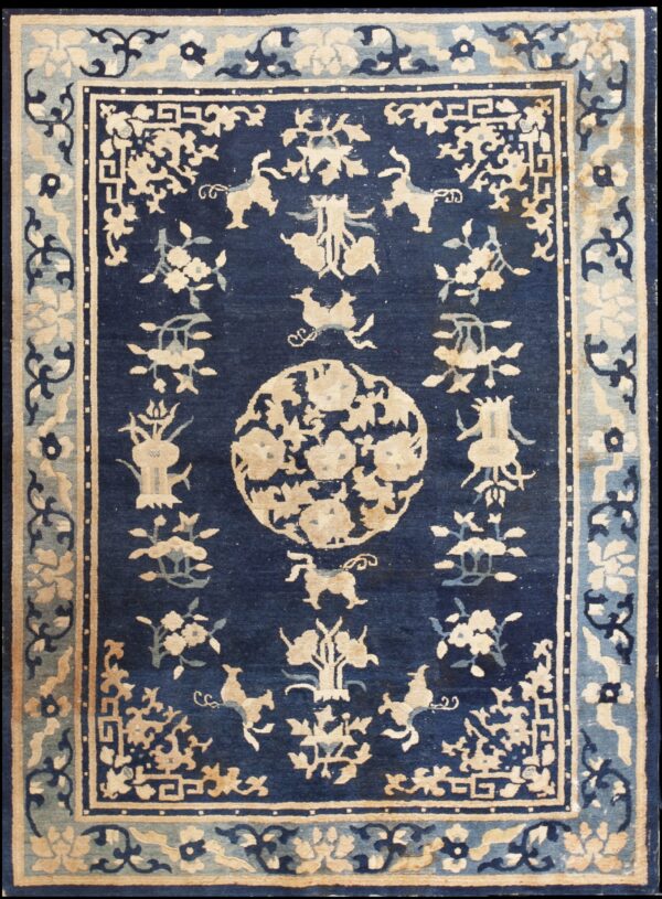 Indigo blue rug featuring complex beige floral and animal designs within ornate, multi-banded borders.