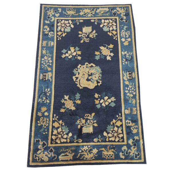 Antique peking small scatter size wool navy rug 1 Navy area rug with an ornate gold and teal floral pattern and a complex medium blue border.