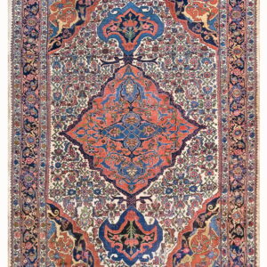 Traditional rug featuring a rust and navy medallion on a dense ivory field with intricate floral patterns.
