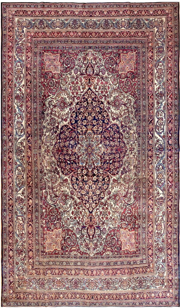 Intricate traditional rug featuring a large navy medallion on a cream and burgundy floral field.