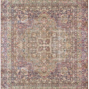 Distressed low-pile rug featuring an ornate medallion pattern in faded pink, navy, and beige.