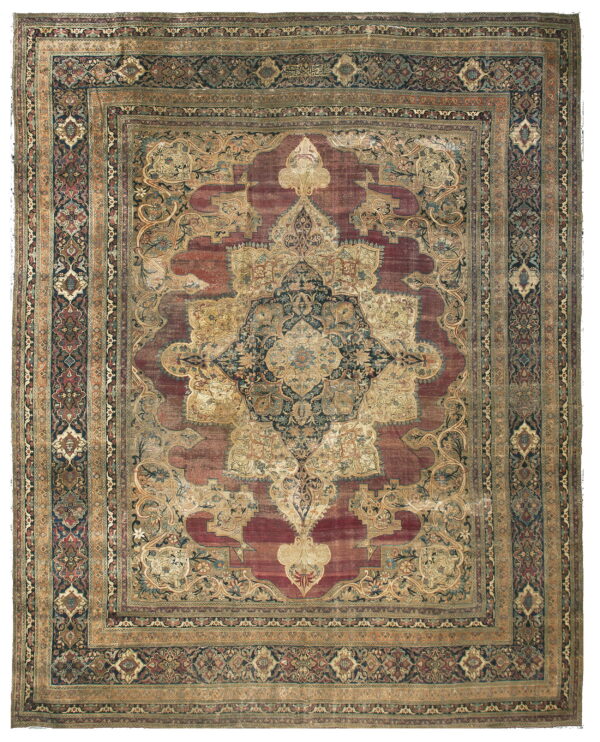 Traditional rug featuring a large navy and gold medallion on a faded maroon field with ornate borders.