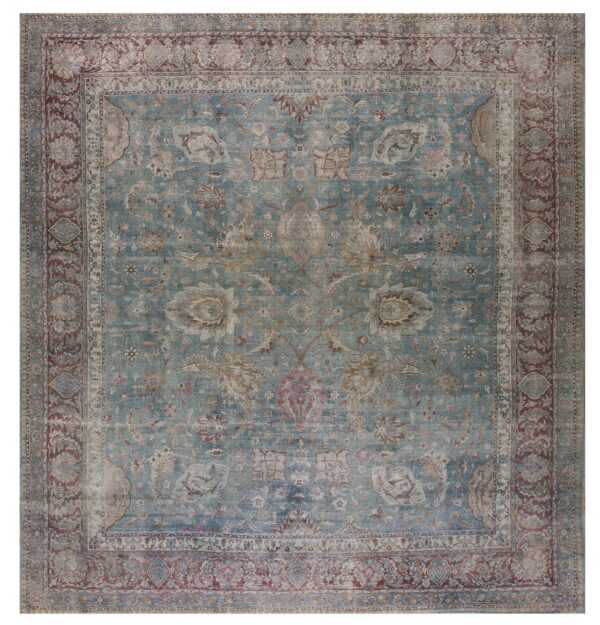 Distressed traditional rug featuring a teal field, complex borders, and floral patterns in rust and beige.