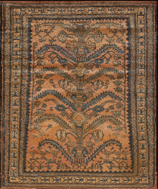 Terracotta rug featuring a stylized blue and gold medallion design and elaborate geometric borders.