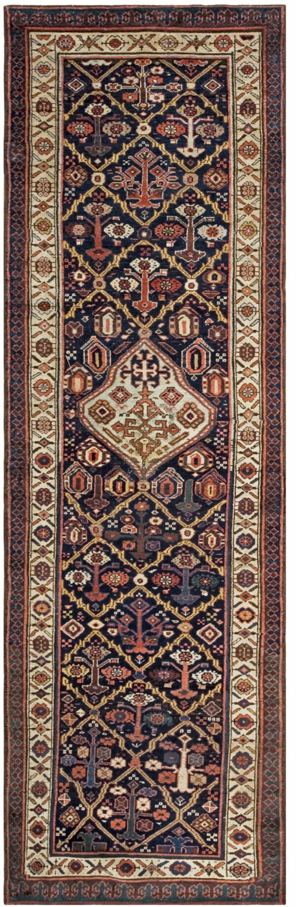 Dark blue runner rug featuring a central ivory medallion and geometric tribal patterns in rust, gold, and tan.