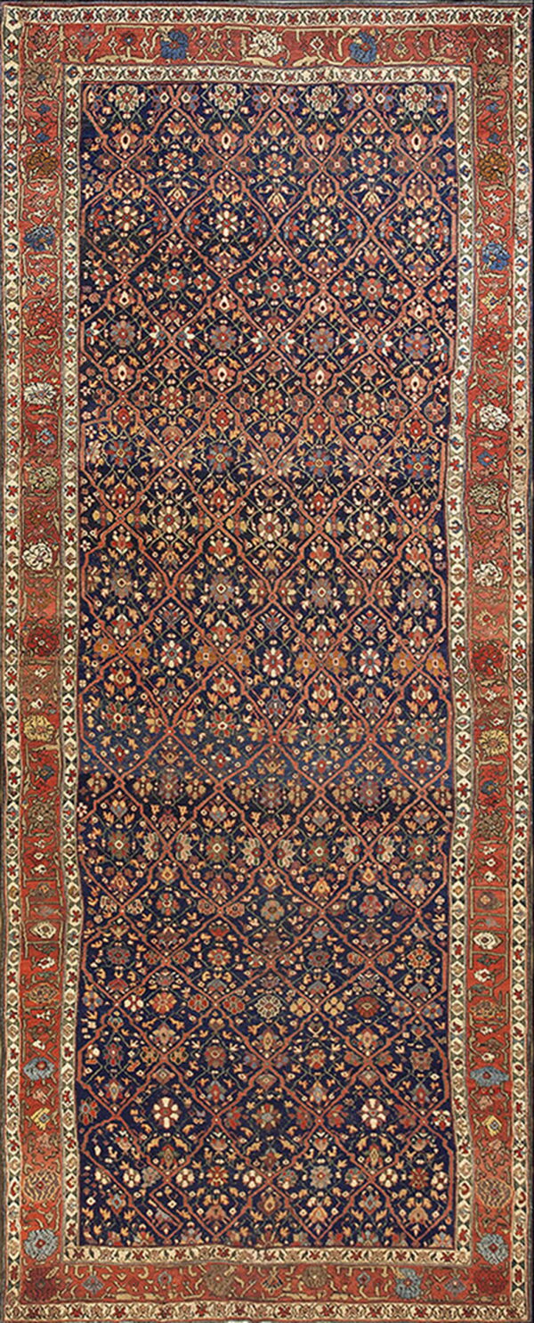 Highly detailed blue rug with a dense all-over floral pattern and wide contrasting red borders.