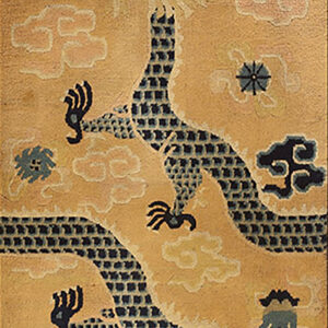 Detailed view of a gold rug with a segmented dark blue dragon and swirling pastel cloud motifs.