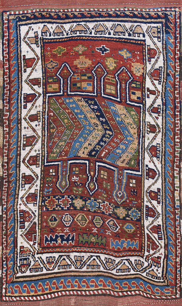 Reddish-brown rug featuring complex geometric patterns, zigzag stripes, and detailed borders in navy, cream, and green.