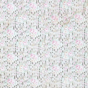 A light rug with pink floral roses layered over a faint taupe vertical striped background.