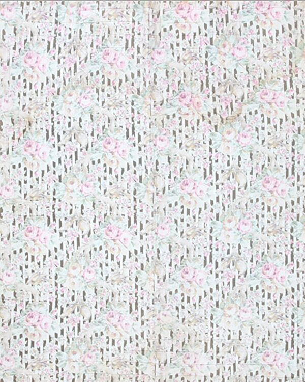 A light rug with pink floral roses layered over a faint taupe vertical striped background.