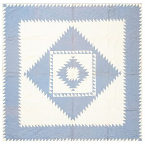 Geometric textile featuring concentric blue and white diamond patterns composed of saw-tooth triangles.