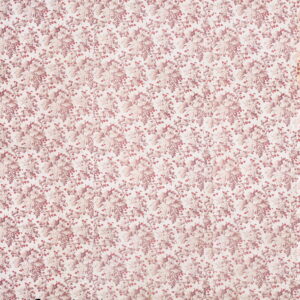 Repeating pattern of dusty pink and cream grape clusters, leaves, and vines on a flat textile.