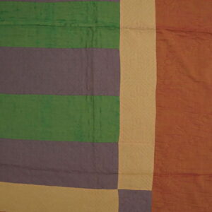 Quilted textile featuring wide stripes of green, purple, tan, and rust colors with visible patterns.