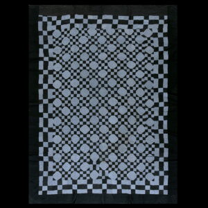 Black and gray geometric rug featuring a checkered lattice pattern and repeating octagonal shapes.