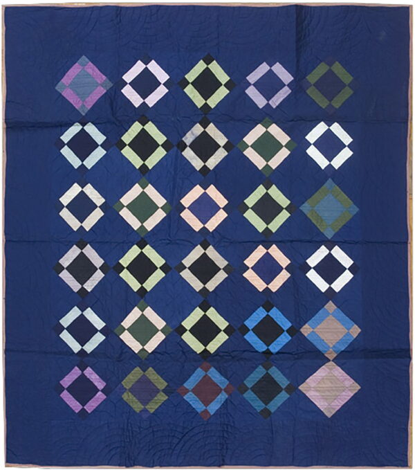 Flat navy blue textile featuring alternating rows of large, multicolored, framed geometric diamonds.